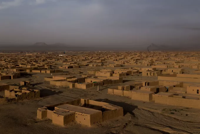 Houses with flat roofs in a desert landscape