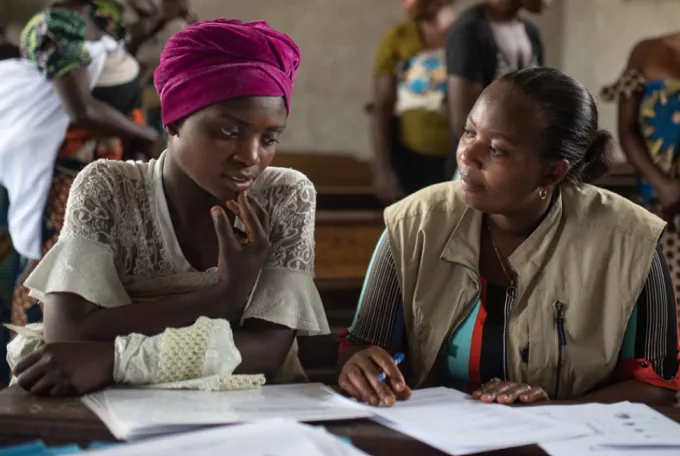 DRC. Psychosocial work. 2020. Leontine Heri Basengo, a psychosocial worker for Action contre la Faim, talks with Esther Bunyere to better understand her mental state after the SMPS session at a school in Kichanga. © Olivia Acland pour Action contre la Faim