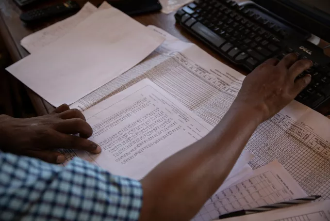 Christopher Mungai, a meteorological technician at the Kenya Meteorological Department in Taita Taveta adds weather data collected from the station into a global system. Observations must be uploaded to the system immediately after being registered.